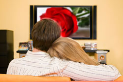 Winners of the Blooms in Hi-Def Sweepstakes enjoying flowers and a new HD TV